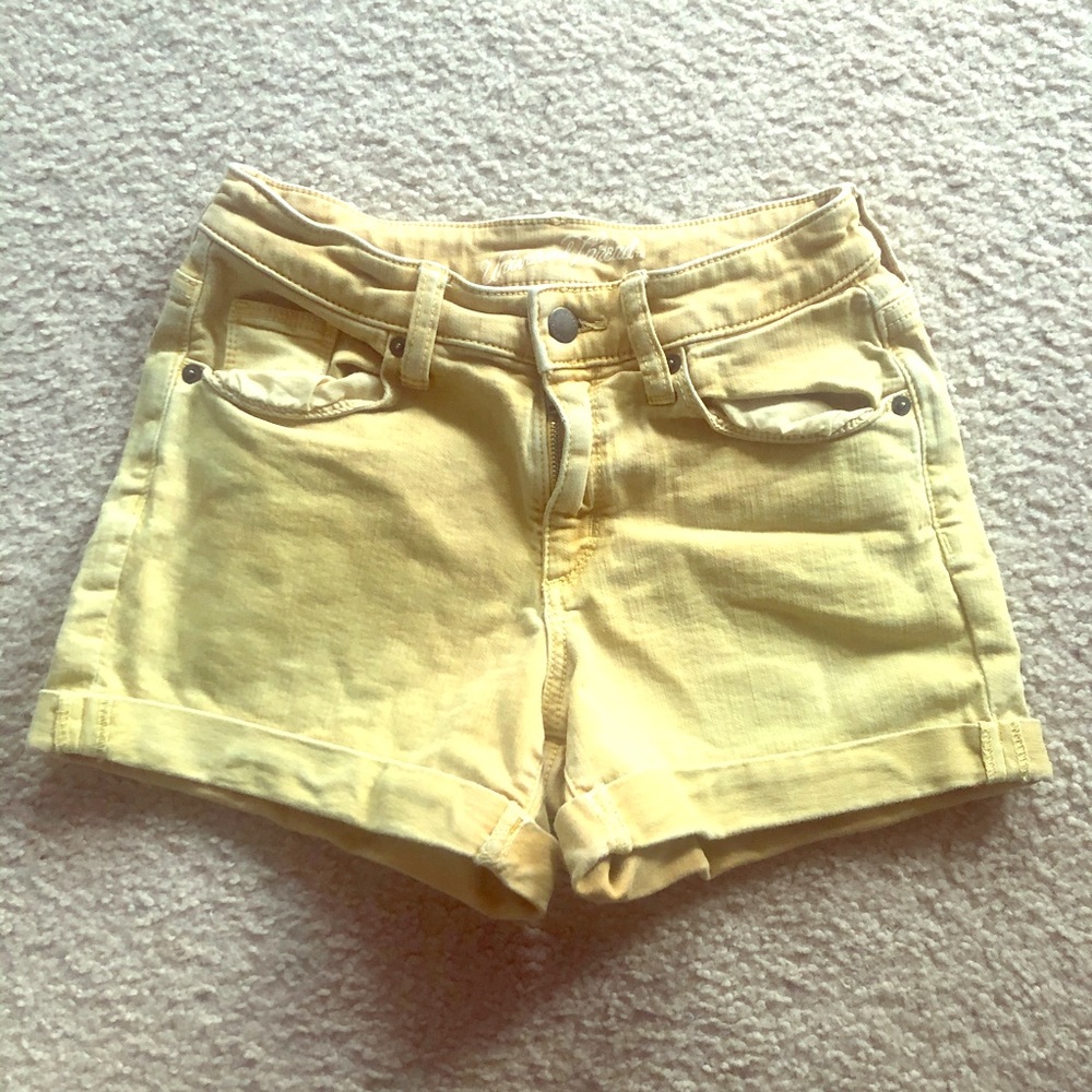Beautiful faded yellow denim jean shorts.